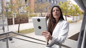 A skilled professional woman enjoys the outdoors while using a tablet for a virtual meeting, showcasing the modern concept of worklife balance in todays fastpaced employment landscape - Powered by Shutterstock - Get 15% off with code: PIKWIZARD15