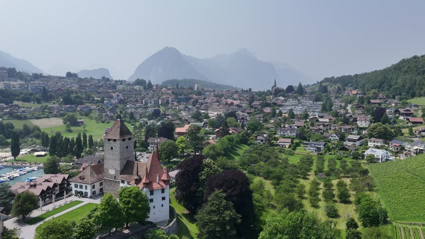 Spiez Town on lake Thun Switzerland drone, aerial mountains in background