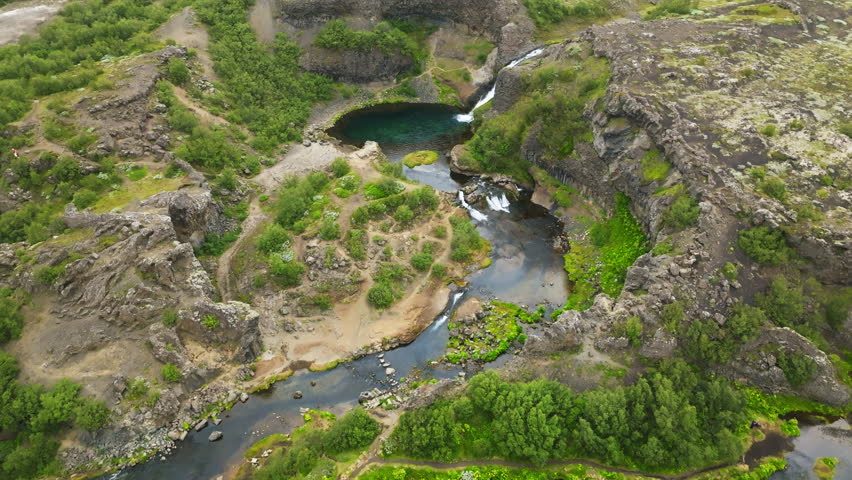 Aerial view of the Gjáin valley in Iceland is like a small oasis with waterfalls and lots of greenery.