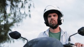 The motorcycle rider flips down his helmet visor. - Powered by Shutterstock - Get 15% off with code: PIKWIZARD15