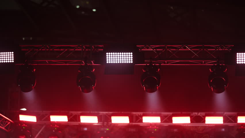 Celling Spotlights Illuminate The Concert Stage During A Light Show