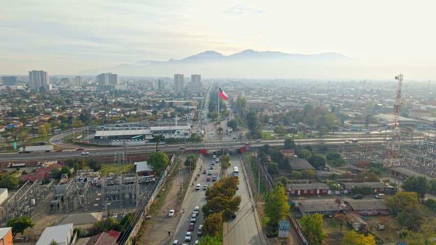 Revealing Rancagua city along the Pan-American highway with a large Chilean flag