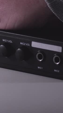 jack connector connection to sound device. volume, echo, mic, sound effects. karaoke. close-up. Vertical