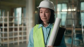 Asian woman civil engineer architect builder in hard hat speak walkie talkie portable radio remote control Chinese Japanese Korean girl industrial worker construction developer building inspector work - Powered by Shutterstock - Get 15% off with code: PIKWIZARD15