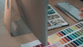 A vibrant workspace of a designer featuring a colorful palette, design tools, and sketchbook, capturing the essence of creativity and artistic exploration. SACTR - Powered by Shutterstock - Get 15% off with code: PIKWIZARD15