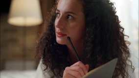 Thoughtful dreaming young woman write notes in bed Caucasian girl student noting thoughts in diary morning bedroom home smiling dreamy creative female teen planning writing ideas studying in apartment - Powered by Shutterstock - Get 15% off with code: PIKWIZARD15