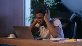 Stressed businessman African American business man in office deadline difficult job problem laptop working online trouble mistake failure upset computer overtime night working sad overworked employee - Powered by Shutterstock - Get 15% off with code: PIKWIZARD15
