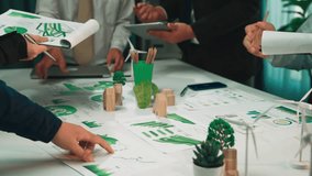 A dynamic office environment showcasing teamwork and collaboration during a brainstorming session, utilizing technology and visual data for innovative solutions and sustainable growth. SACTR - Powered by Shutterstock - Get 15% off with code: PIKWIZARD15