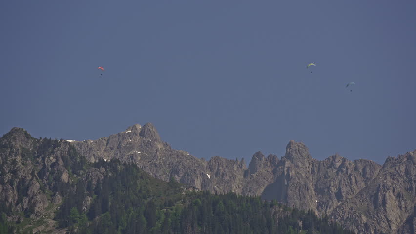 Paragliders Go Paragliding Over Mont Blanc Mountain in French Alps