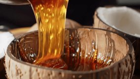 Golden Syrup Pouring into Coconut Shell Bowls, Sweet Treat - Powered by Shutterstock - Get 15% off with code: PIKWIZARD15