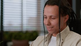 Ethnic guy business man male businessman with laptop using smartphone technology global connections communication in office chatting social media mobile phone app at workplace professional specialist - Powered by Shutterstock - Get 15% off with code: PIKWIZARD15