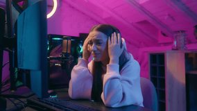 Caucasian upset worried anxiety female gamer girl woman looking at computer monitor playing online video game lost stream failure bad result talking with friends with microphone and headset streamer - Powered by Shutterstock - Get 15% off with code: PIKWIZARD15