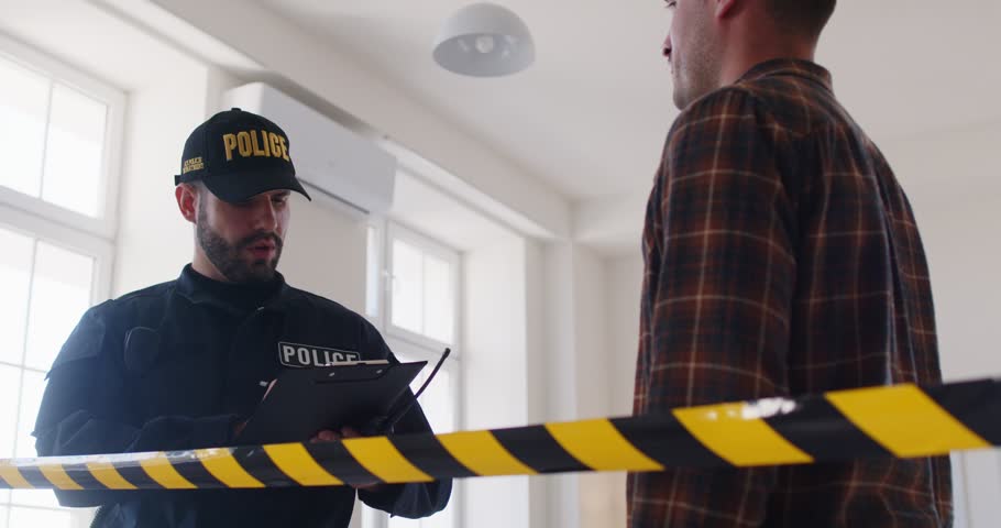 Concentrated detective or police officer is taking testimony from a witness at a crime scene, collecting evidence and investigating an accident or robbery, ensuring security and justice.