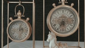 ornate twin clocks with roman numerals in brass metal frames - Powered by Shutterstock - Get 15% off with code: PIKWIZARD15