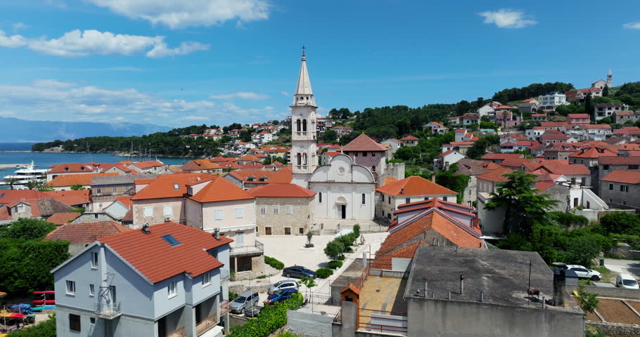 Medieval Town With The View Of Saint Mary Church Tower In Jelsa, Hvar Island, Croatia. Aerial Drone Shot