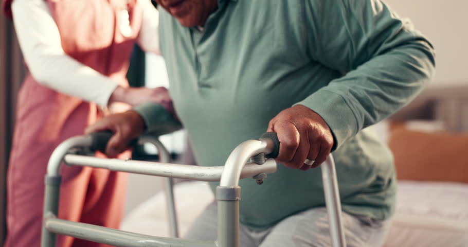 Nurse, hands and senior with walker for assisted living or help in bedroom or retirement home. Man, caregiver and aiding elderly person with a disability or patient for mobility, balance or recovery