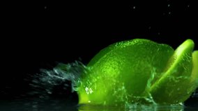 Fresh lime slices splashing into clear water with bubbles and black background. Perfect for beverage concepts, citrus freshness, healthy drinks, detox visuals, and underwater fruit motion. 4k 60fps. - Powered by Shutterstock - Get 15% off with code: PIKWIZARD15