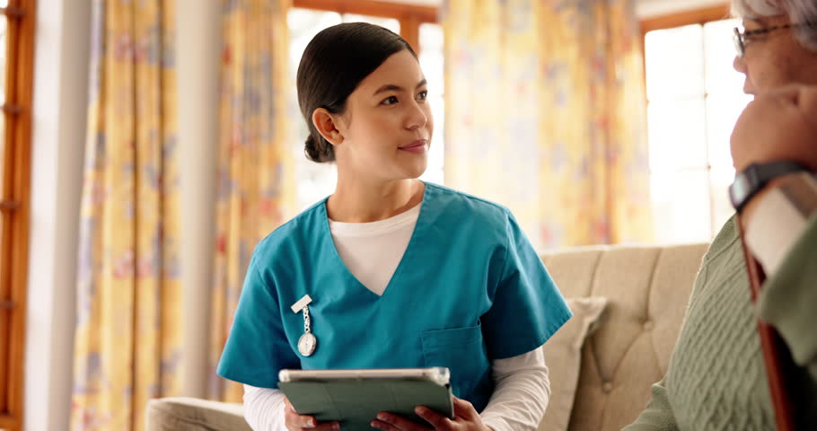 Woman, nurse and tablet with senior patient for assisted living or healthcare in retirement home. Female people, caregiver and listening to client with technology for elderly care in old age house