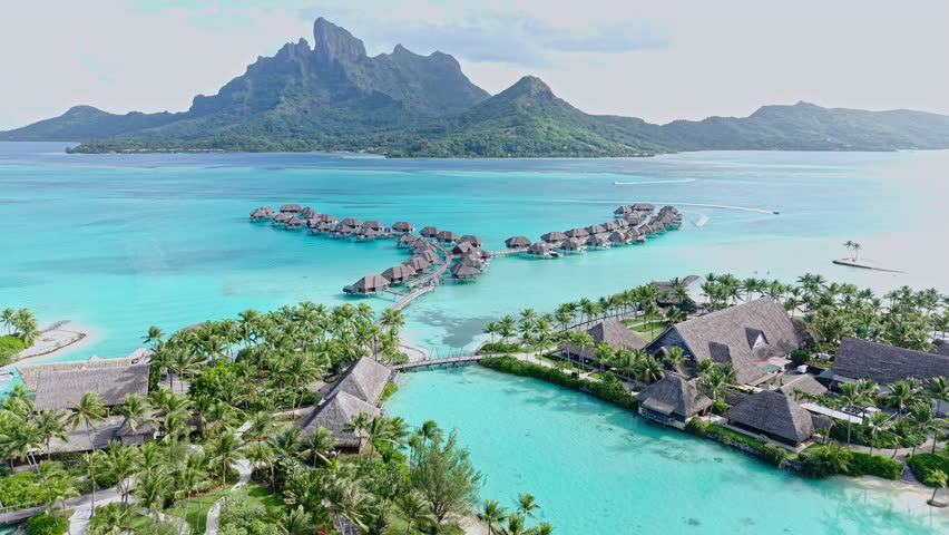 Bora Bora, French Polynesia. Aerial View of Luxury Resort and Overwater Bungalows Overlooking Lagoon and Main Island