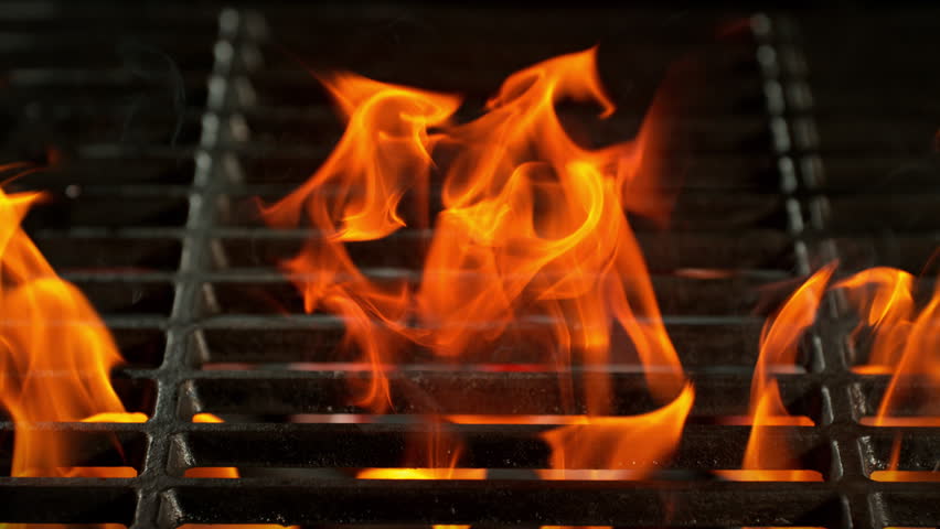Super Slow Motion Shot of Tasty Beef Steak Meat Falling on Hot Grill with Flames at 1000fps