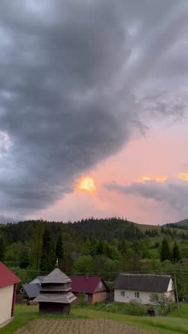 sunset in the mountains in a village in the Carpathians