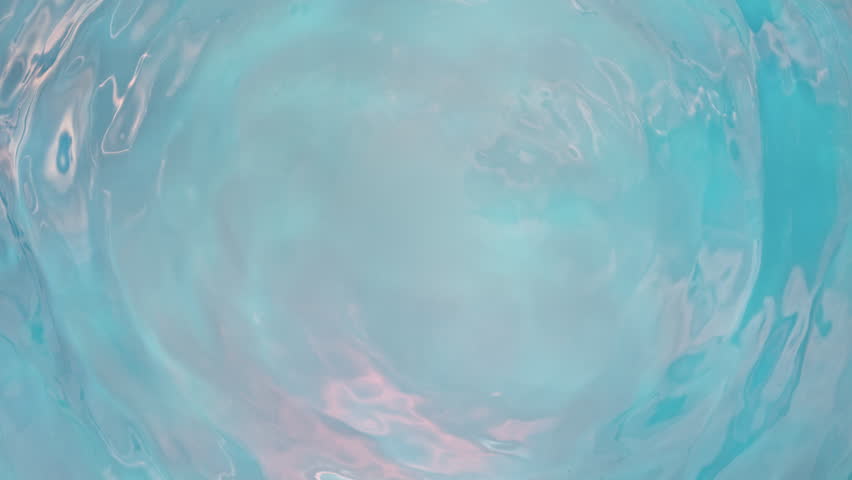 Super Slow Motion Abstract Shot of Gently Rippling Light Blue Water Background at 1000fps.