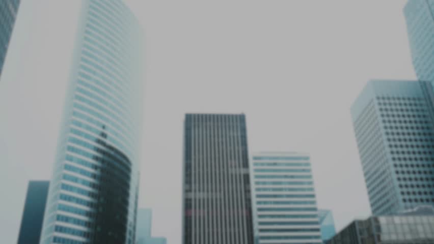 A visual effect of green matrix-style code falls over a dark, modern cityscape. This clip evokes themes of cyberspace, big data, hacking, and artificial intelligence - Powered by Shutterstock - Get 15% off with code: PIKWIZARD15