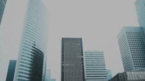 A visual effect of green matrix-style code falls over a dark, modern cityscape. This clip evokes themes of cyberspace, big data, hacking, and artificial intelligence - Powered by Shutterstock - Get 15% off with code: PIKWIZARD15