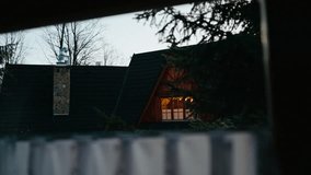Wooden cabin glows with warm window light at dusk, offering serenity in quiet landscape, serenity enchants viewers, serenity suits cozy home videos, perfect for evening retreats. Cozy wooden cabin - Powered by Shutterstock - Get 15% off with code: PIKWIZARD15