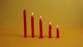 Row of Burning Red Candles in Different Stages of Melting – Visual Concept of Changing States of Matter in 4K Ultra HD - Powered by Shutterstock - Get 15% off with code: PIKWIZARD15