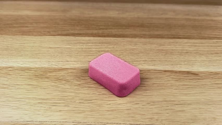 Close-Up of Hand Cutting Pink Kinetic Sand Block with Vegetable Slicer – Satisfying ASMR Texture and Sensory Play in 4K Ultra HD