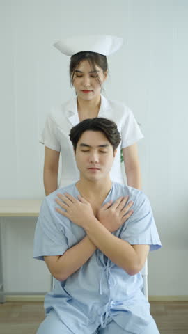 Nurse assisting male patient during rehabilitation therapy session, performing physical adjustment or chiropractic technique to relieve neck pain, muscle tension, and improve mobility in healthcare.