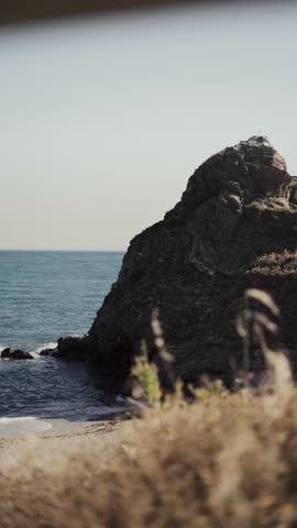 Serene coastal view with rocky cliffs and turquoise waters. la cala de mijas, El faro Costa del Sol 