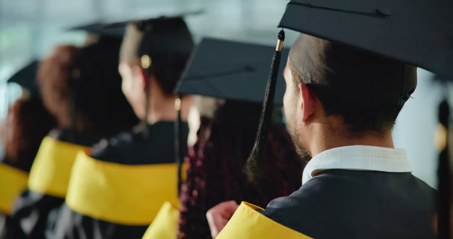 Man, students and applause at graduation ceremony for education, achievement and announcement. Back, people and clapping hands in row for award event, academic success and congratulations for diploma