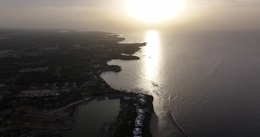 An aerial view of sunset, showcasing the serene coastline and lush landscape of Puerto Rico