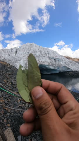 Offering Coca Leaves to Pachamama: Sacred Ritual Near Glacier and Meltwater Lagoon