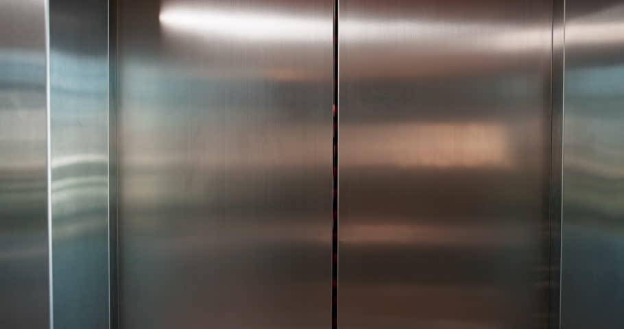 Business, people and exit elevator in office for work arrival, enter building and company floor. Professional, employees and walking from lift in morning for leaving meeting, appointment and greeting
