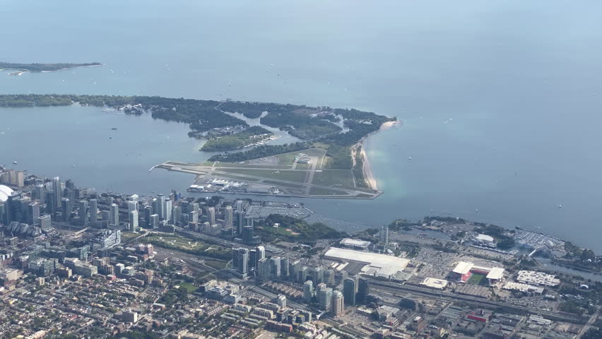 An aerial view slowly revealing downtown Toronto from west to east