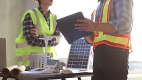 Engineer and manager discussing blueprint outdoors; wearing helmets, planning property development project with laptop and tablet, teamwork, strategy, innovation, safety, construction, real estate, pr - Powered by Shutterstock - Get 15% off with code: PIKWIZARD15