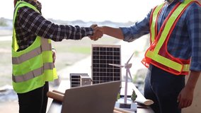 Engineer and manager discussing blueprint outdoors; wearing helmets, planning property development project with laptop and tablet, teamwork, strategy, innovation, safety, construction, real estate, pr - Powered by Shutterstock - Get 15% off with code: PIKWIZARD15