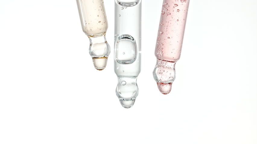 Pipette with Serum, Gel, Oil or Other Cosmetic Product Dripping Slow Motion. Macro Shot of Natural Organic Cosmetics, Medicine. Production Close-up. Skin or Body Care Products