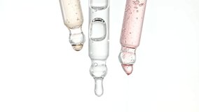 Pipette with Serum, Gel, Oil or Other Cosmetic Product Dripping Slow Motion. Macro Shot of Natural Organic Cosmetics, Medicine. Production Close-up. Skin or Body Care Products - Powered by Shutterstock - Get 15% off with code: PIKWIZARD15