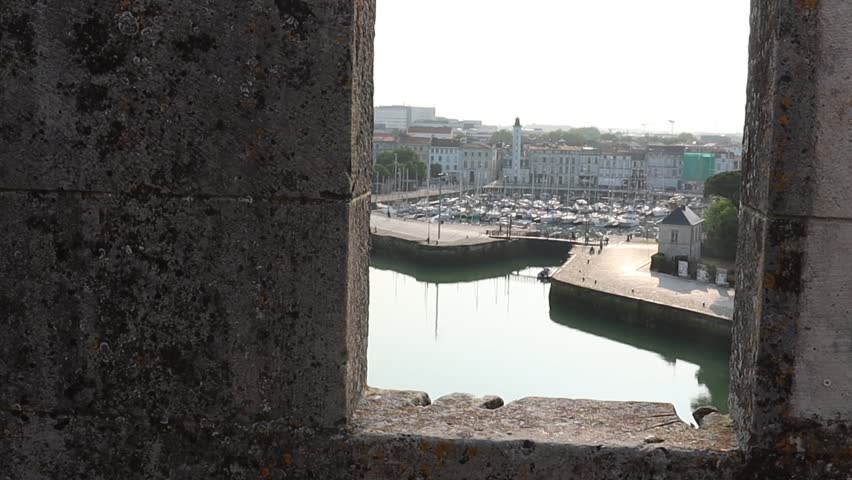 Old harbor and towers of La Rochelle in early summer morning, tourism in Charente Maritime, France.
Tour de La Chaine and Tour Saint Nicolas.