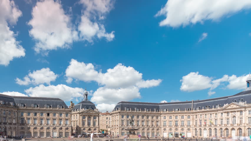 Main square and fountain hyperlapse, reflecting historic architecture. Tourists enjoy the landmark. Timelapse of traffic and tram passing by.
