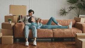 Couple enjoys quality time at home while relocating to a new apartment - Powered by Shutterstock - Get 15% off with code: PIKWIZARD15