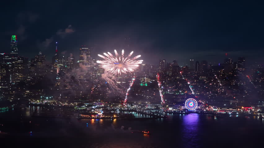 An aerial view captures vibrant fireworks illuminating the San Francisco skyline on Independence Day, showcasing a magnificent display of colors and lively celebrations that embody the holiday spirit - Powered by Shutterstock - Get 15% off with code: PIKWIZARD15