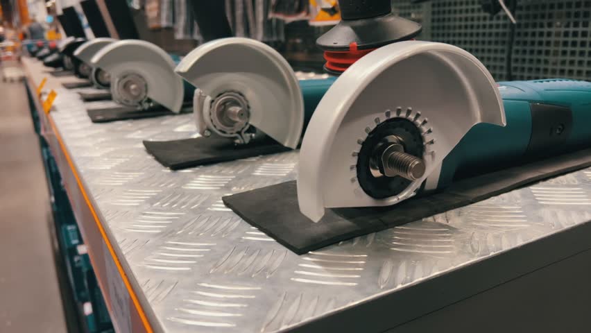 New angle grinders on shelf in hardware store with power tools display