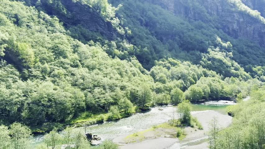 Experience the breathtaking Flåm train ride through Norway’s dramatic mountains, deep valleys, and sparkling lakes—ideal for travel, nature, and scenic landscape stock photos.