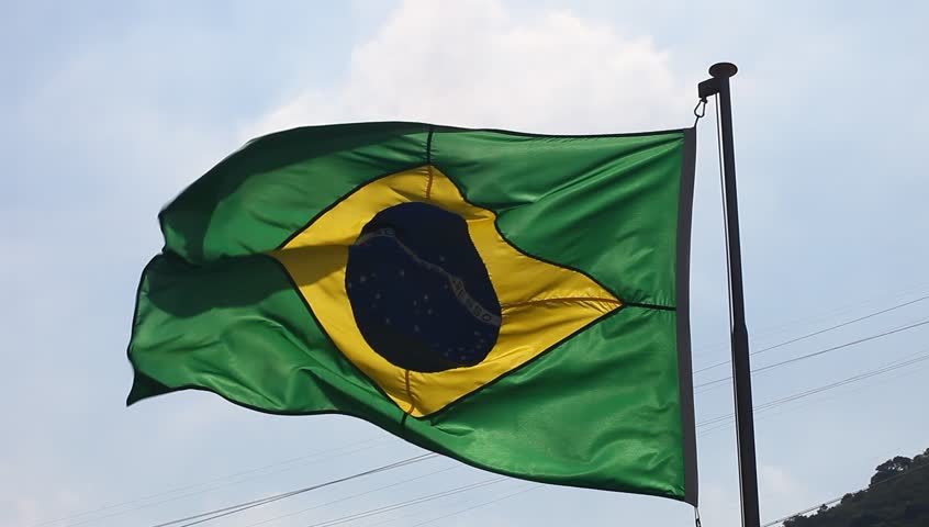 Brazilian flag with a blue sky 