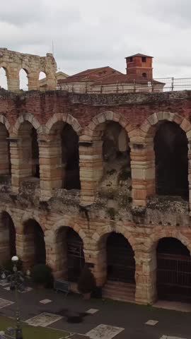 Ancient ruins in Verona, Italy with workers visible near a historical building
